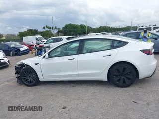 2025 Tesla Model 3 Long Range with VIN 5YJ3E1EA0SF932385, listed as a IAAI auction lot 41772613 with 1,683 mi miles and . Bid and sale history available at carsss.com. Image 14.