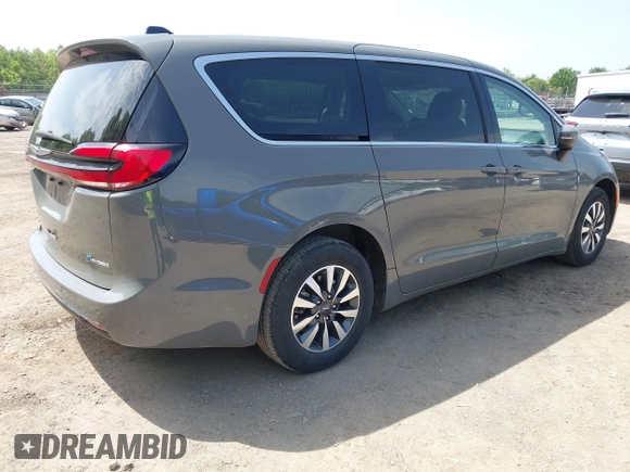 2023 Chrysler Pacifica Hybrid Touring L with VIN 2C4RC1L73PR522988, listed as a IAAI auction lot 42280263 with 54,939 mi miles and . Bid and sale history available at DreamBid. Image 4.