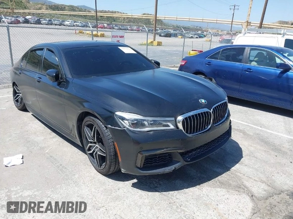 2018 BMW 7 Series 750i with VIN WBA7F0C51JGM23504, listed as a IAAI auction lot 39379378 with 82,251 mi miles. Bid and sale history available at carsss.com. Image 1.