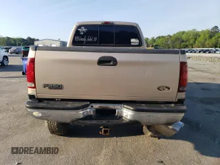 1999 Ford F-250 XL with VIN 1FTNX21F0XEE70963, listed as a Copart auction lot 52294955 with 218,969 mi miles and Salvage title. Bid and sale history available at DreamBid. Image 6.