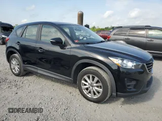 2016 Mazda CX-5 Sport with VIN JM3KE4BY6G0749973, listed as a Copart auction lot 54131635 with 97,480 mi miles and Salvage title. Bid and sale history available at DreamBid. Image 4.
