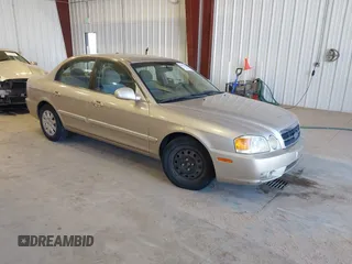 2004 Kia Optima LX z VIN KNAGD126845321705, wystawiony jako IAAI lot #41879218 z przebiegiem 94 956 mil mil oraz . Historia ofert i sprzedaży dostępna na DreamBid. Obrazek 1.