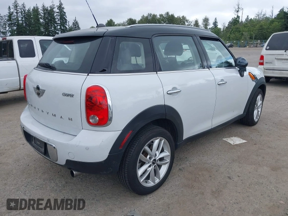 2014 MINI Countryman with VIN WMWZB3C5XEWR37594, listed as a IAAI auction lot 42500466 with 67,589 mi miles and . Bid and sale history available at DreamBid. Image 4.
