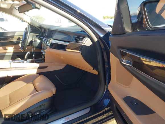 2012 BMW 7 Series 750Li xDrive with VIN WBAKC8C52CC436399, listed as a IAAI auction lot 41214440 with 122,532 mi miles and . Bid and sale history available at DreamBid. Image 5.