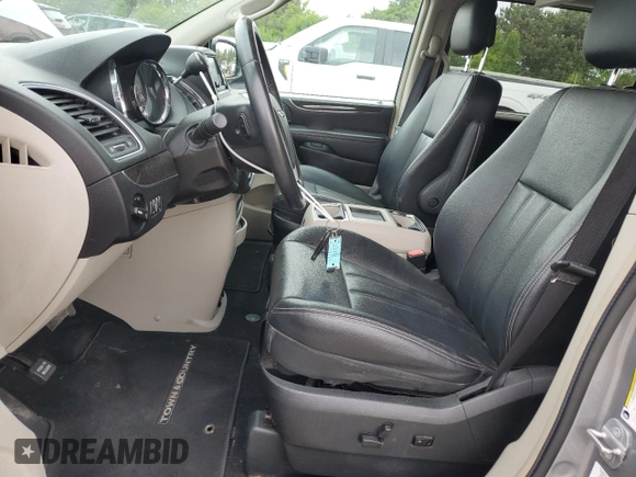 2014 Chrysler Town & Country Touring with VIN 2C4RC1BG1ER225720, listed as a Copart auction lot 58071165 with 104,502 mi miles and Salvage title. Bid and sale history available at DreamBid. Image 7.