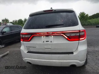 2014 Dodge Durango SXT with VIN 1C4RDJAG0EC561950, listed as a IAAI auction lot 42650331 with 106,959 mi miles and . Bid and sale history available at DreamBid. Image 17.
