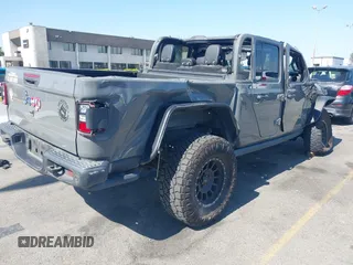 2021 Jeep Gladiator 80th Anniversary z VIN 1C6HJTAG7ML564981, wystawiony jako IAAI lot #42455062 z przebiegiem 89 721 mil mil oraz . Historia ofert i sprzedaży dostępna na DreamBid. Obrazek 4.