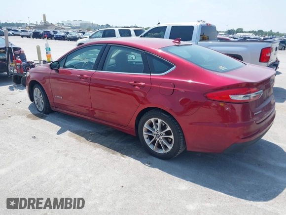 2019 Ford Fusion Hybrid SE with VIN 3FA6P0LU6KR243678, listed as a IAAI auction lot 40004890 with 138,533 mi miles. Bid and sale history available at carsss.com. Image 3.