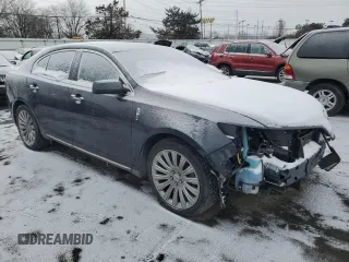2014 Lincoln MKS with VIN 1LNHL9EK0EG602349, listed as a Copart auction lot 45211525 with 51,616 mi miles and Salvage Title. Bid and sale history available at DreamBid. Image 4.