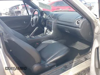 2003 Mazda MX-5 Miata Cloth with VIN JM1NB353730311899, listed as a IAAI auction lot 41929811 with 99,589 mi miles and . Bid and sale history available at DreamBid. Image 5.