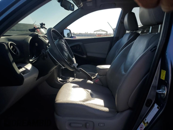 2010 Toyota RAV4 Limited with VIN JTMYK4DV1AD003591, listed as a Copart auction lot 61499555 with 100,940 mi miles and Salvage title. Bid and sale history available at DreamBid. Image 7.
