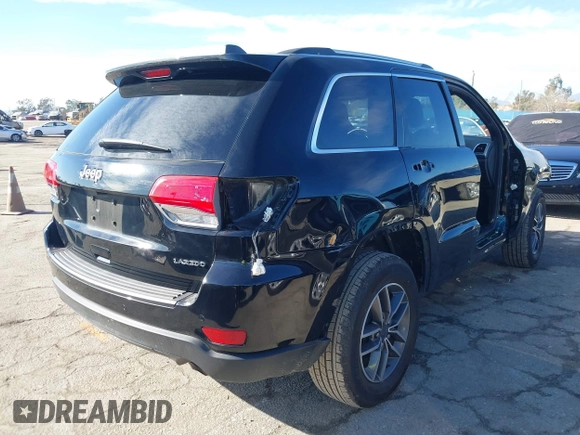 2019 Jeep Grand Cherokee Altitude with VIN 1C4RJEAG7KC852263, listed as a IAAI auction lot 41590946 with 83,356 mi miles and . Bid and sale history available at DreamBid. Image 4.