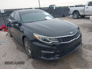 2019 Kia Optima LX z VIN 5XXGT4L30KG348269, wystawiony jako IAAI lot #42463095 z przebiegiem 86 764 mil mil oraz . Historia ofert i sprzedaży dostępna na DreamBid. Obrazek 1.