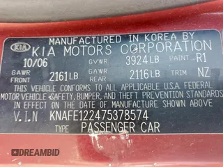 2007 Kia Spectra EX with VIN KNAFE122475378574, listed as a Copart auction lot 56921925 with 142,268 mi miles and Salvage title. Bid and sale history available at DreamBid. Image 12.