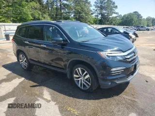 2017 Honda Pilot Touring z VIN 5FNYF6H93HB051982, wystawiony jako Copart lot #53390535 z przebiegiem Nie podano mil oraz Szkoda całkowita • Salvage title. Historia ofert i sprzedaży dostępna na DreamBid. Obrazek 4.