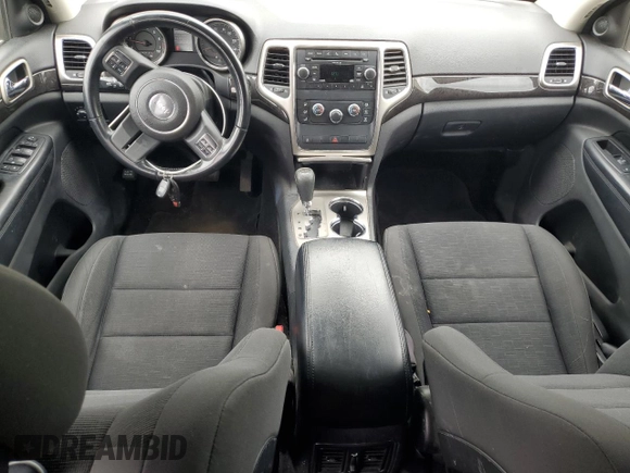2011 Jeep Grand Cherokee Laredo with VIN 1J4RR4GG9BC515467, listed as a Copart auction lot 58411085 with 112,558 mi miles and Salvage title. Bid and sale history available at DreamBid. Image 8.