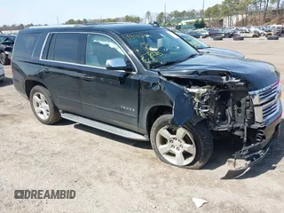 2015 Chevrolet Tahoe LTZ z VIN 1GNSKCKC9FR513190, wystawiony jako IAAI lot #41908177 z przebiegiem 131 275 mil mil oraz . Historia ofert i sprzedaży dostępna na DreamBid. Obrazek 1.