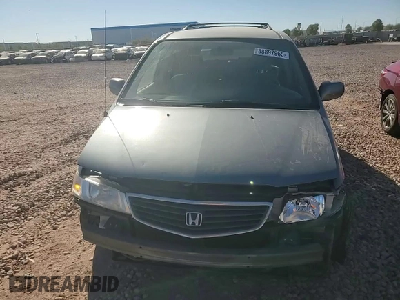 1999 Honda Odyssey EX with VIN 2HKRL1860XH541737, listed as a Copart auction lot 88897965 with 112,164 mi miles and Salvage title. Bid and sale history available at DreamBid. Image 11.