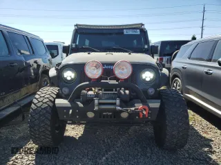2014 Jeep Wrangler Unlimited Sport with VIN 1C4BJWDG1EL308834, listed as a Copart auction lot 53710065 with 127,612 mi miles and Clean Title. Bid and sale history available at DreamBid. Image 5.