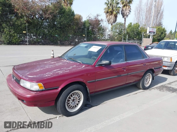 1991 Toyota Camry z VIN JT2SV21E0M3462782, wystawiony jako IAAI lot #41841451 z przebiegiem 214 611 mil mil oraz . Historia ofert i sprzedaży dostępna na DreamBid. Obrazek 2.