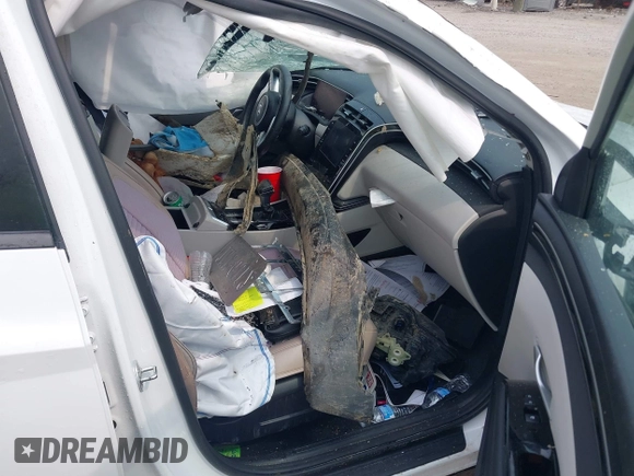 2022 Hyundai Tucson SEL z VIN 5NMJC3AE3NH057663, wystawiony jako IAAI lot #42428386 z przebiegiem 78 740 mil mil oraz . Historia ofert i sprzedaży dostępna na DreamBid. Obrazek 5.