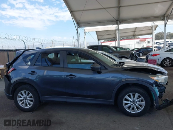2014 Mazda CX-5 Touring with VIN JM3KE2CY9E0384401, listed as a IAAI auction lot 41699913 with 75,301 mi miles. Bid and sale history available at carsss.com. Image 13.