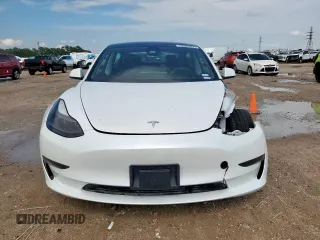2023 Tesla Model 3 with VIN 5YJ3E1EA1PF550454, listed as a Copart auction lot 58985695 with 19,199 mi miles and Salvage title. Bid and sale history available at DreamBid. Image 5.