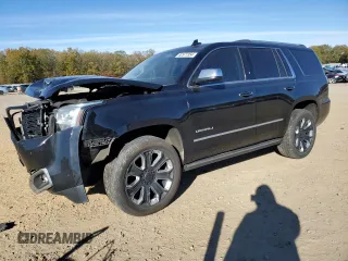 2018 GMC Yukon Denali with VIN 1GKS2CKJ3JR404177, listed as a Copart auction lot 82577354 with 129,744 mi miles and Salvage Title. Bid and sale history available at carsss.com. Image 1.