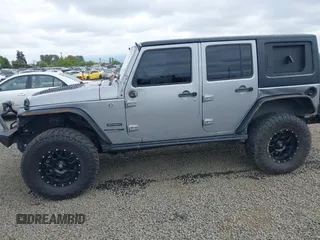 2018 Jeep Wrangler Unlimited Sport S with VIN 1C4BJWDG4JL861052, listed as a IAAI auction lot 42100517 with 43,907 mi miles and . Bid and sale history available at DreamBid. Image 6.