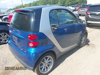 2009 Smart fortwo Pure with VIN WMEEJ31X79K210162, listed as a IAAI auction lot 42715203 with 95,089 mi miles and . Bid and sale history available at DreamBid. Image 4.