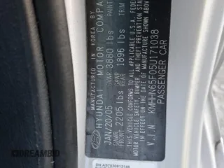 2005 Hyundai Tiburon GT z VIN KMHHN65F05U171038, wystawiony jako Copart lot #87765735 z przebiegiem 113 129 mil mil oraz Szkody całkowita. Historia ofert i sprzedaży dostępna na DreamBid. Obrazek 14.