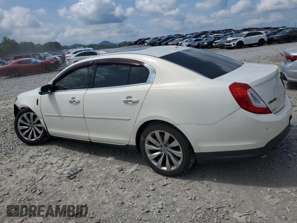 2013 Lincoln MKS with VIN 1LNHL9EK8DG605675, listed as a Copart auction lot 62448455 with 102,642 mi miles and Salvage title. Bid and sale history available at DreamBid. Image 2.