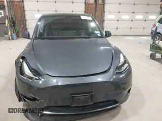 2023 Tesla Model Y Long Range with VIN 7SAYGAEE2PF755674, listed as a IAAI auction lot 41890025 with 24,783 mi miles and . Bid and sale history available at DreamBid. Image 12.