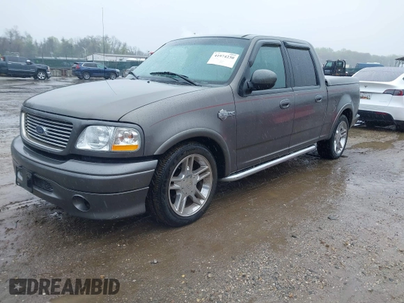 2002 Ford F-150 Harley Davidson with VIN 1FTRW07392KD29874, listed as a IAAI auction lot 41974230 with 163,279 mi miles. Bid and sale history available at carsss.com. Image 18.