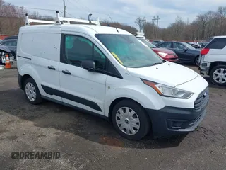 2019 Ford Transit Connect XL z VIN NM0LS6E29K1391292, wystawiony jako IAAI lot #41801140 z przebiegiem 90 463 mil mil oraz . Historia ofert i sprzedaży dostępna na DreamBid. Obrazek 1.