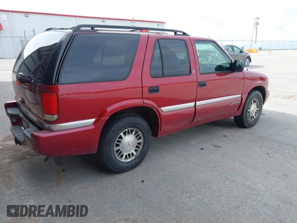 1999 GMC Jimmy SLE with VIN 1GKDT13W3X2504723, listed as a IAAI auction lot 41858184 with 239,227 mi miles. Bid and sale history available at carsss.com. Image 4.