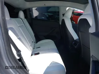 2024 Tesla Model Y Performance with VIN 7SAYGDEF9RA299036, listed as a IAAI auction lot 42140788 with 14,844 mi miles and . Bid and sale history available at DreamBid. Image 8.