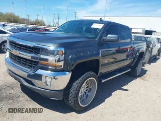 2018 Chevrolet Silverado 1500 LT with VIN 3GCPCREC1JG127396, listed as a IAAI auction lot 41790850 with 138,725 mi miles and . Bid and sale history available at DreamBid. Image 2.