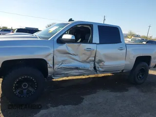 2018 Chevrolet Silverado 1500 LT with VIN 3GCPCREC9JG574686, listed as a IAAI auction lot 41676124 with 74,239 mi miles and . Bid and sale history available at DreamBid. Image 14.