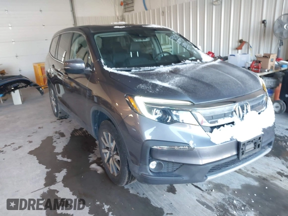 2021 Honda Pilot EX-L with VIN 5FNYF6H56MB037761, listed as a IAAI auction lot 41154468 with 61,159 mi miles. Bid and sale history available at carsss.com. Image 1.