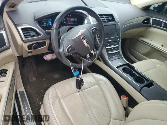 2014 Lincoln MKZ Hybrid z VIN 3LN6L2LU2ER816576, wystawiony jako Copart lot #57030235 z przebiegiem 221 863 mil mil oraz Szkoda całkowita • Salvage title. Historia ofert i sprzedaży dostępna na DreamBid. Obrazek 8.