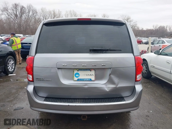 2014 Dodge Grand Caravan American Value with VIN 2C4RDGBG9ER187198, listed as a IAAI auction lot 41669334 with 204,803 mi miles and . Bid and sale history available at DreamBid. Image 17.