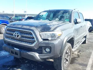 2017 Toyota Tacoma SR5 with VIN 3TMDZ5BN6HM013986, listed as a IAAI auction lot 41418609 with 101,924 mi miles. Bid and sale history available at carsss.com. Image 2.