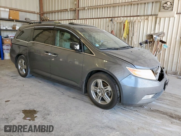 2012 Honda Odyssey Touring с VIN 5FNRL5H94CB049626, выставлен на аукционе Copart как лот 61191435 с пробегом 199 728 миль миль и Списание • Salvage title. История ставок и продаж доступна на DreamBid. Изображение 4.