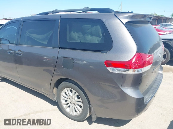 2014 Toyota Sienna XLE with VIN 5TDYK3DC4ES419928, listed as a IAAI auction lot 41976538 with 144,405 mi miles. Bid and sale history available at carsss.com. Image 2.