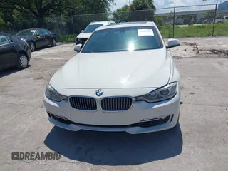 2014 BMW 3 Series 328i with VIN WBA3A5C54EP600398, listed as a IAAI auction lot 42665302 with 117,012 mi miles and . Bid and sale history available at DreamBid. Image 12.