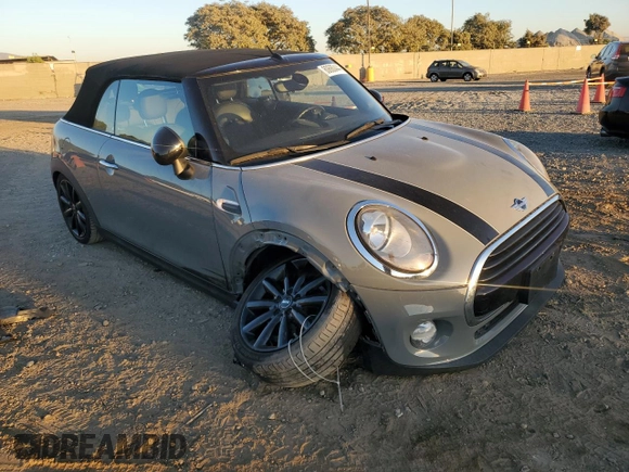 2017 MINI Convertible Cooper with VIN WMWWG5C35H3D00104, listed as a Copart auction lot 80680444 with 33,581 mi miles and Salvage title. Bid and sale history available at DreamBid. Image 4.