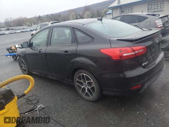 2015 Ford Focus SE with VIN 1FADP3F24FL251916, listed as a Copart auction lot 52800145 with 131,862 mi miles and Salvage Title. Bid and sale history available at DreamBid. Image 2.