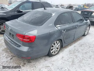 2015 Volkswagen Jetta Sedan 1.8T Sport with VIN 3VWD17AJ6FM319596, listed as a IAAI auction lot 41370591 with 92,818 mi miles. Bid and sale history available at carsss.com. Image 4.