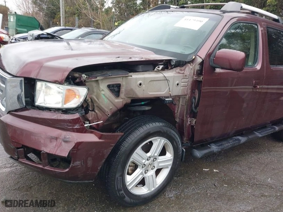 2009 Honda Ridgeline RTL with VIN 5FPYK16559B103698, listed as a IAAI auction lot 41479390 with 144,554 mi miles. Bid and sale history available at carsss.com. Image 6.
